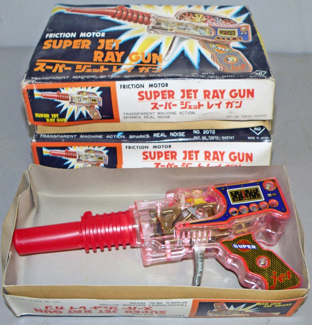 THREE BOXED SUPER JET RAY GUNS: New Old Stock - by KO. Works fine. Box shows minor shelf wear. Box - VF-EX 9 1/4" long