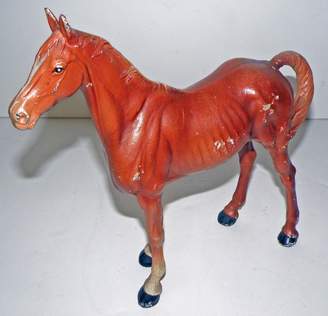 HUBLEY HORSE DOORSTOP: Cast iron with some minor rubs to original paint. 12" long x 11" tall