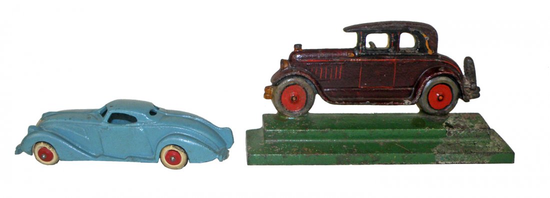 CAST IRON TOY CAR AND AUTOMOBILE DOOR STOP: Doorstop by RH JARVIE Providence, RI with original paint and has some minor paint wear to base. Also comes with an art deco Hubley coupe with original paint. largest 7 3/4"