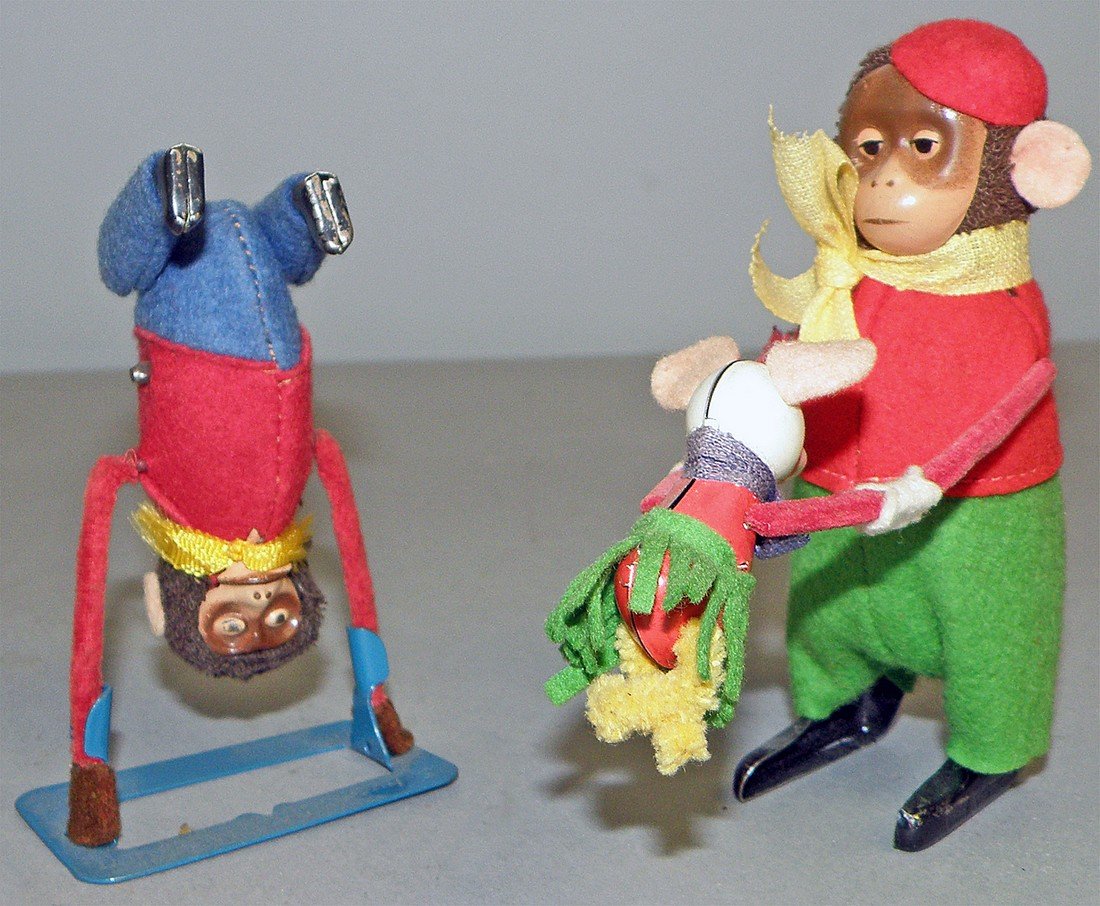 TWO SCHUCO WIND UP MONKEYS: Tumbling Monkey with base and a dancing monkey. Both work fine. largest 4 1/2" tall