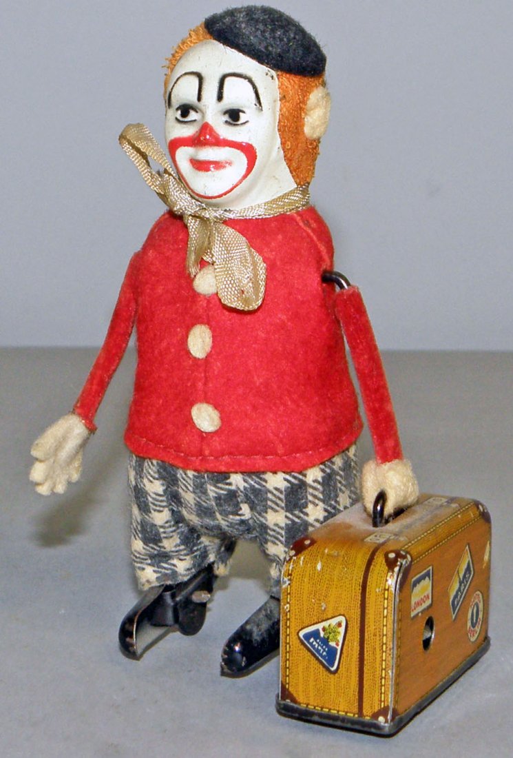 SCHUCO CLOWN WITH SUITCASE: Pre war version works fine. Minor wear. 4 1/2" tall