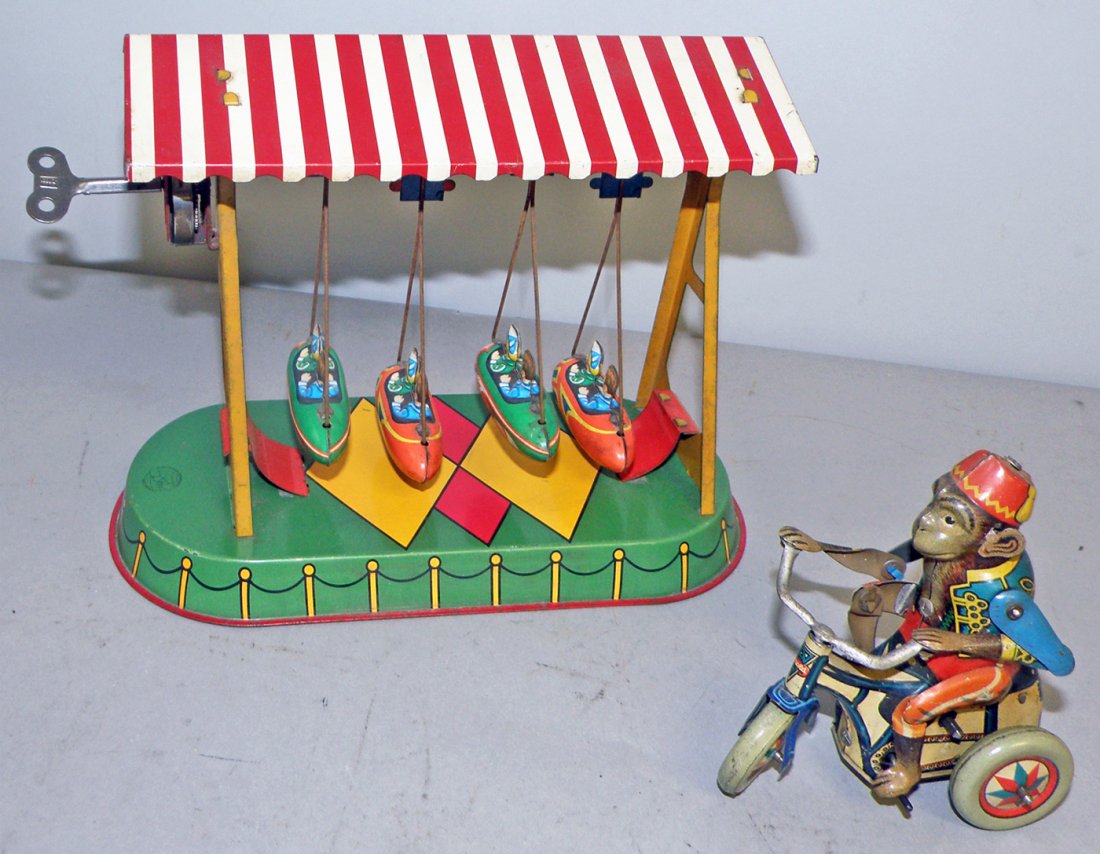TWO WIND UP TIN TOYS: Boby the Monkey tricycle by Arnold. And a swinging toy marked JW. Both work fine. largest 8 1/2" long x 7" tall
