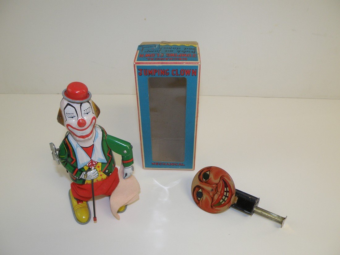 TWO TIN TOYS: 1920's German Sparkler toy and a boxed Mikuni jumping clown. Box is Ex. Largest: 6 1/2" tall