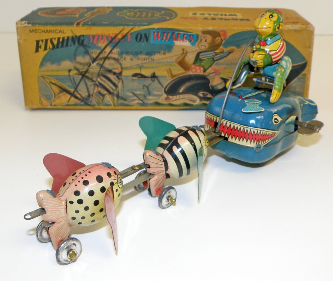 TPS BOXED FISHING MONKEY ON WHALE: Box lid has some minor damage. Box Condition: Fine 9" long