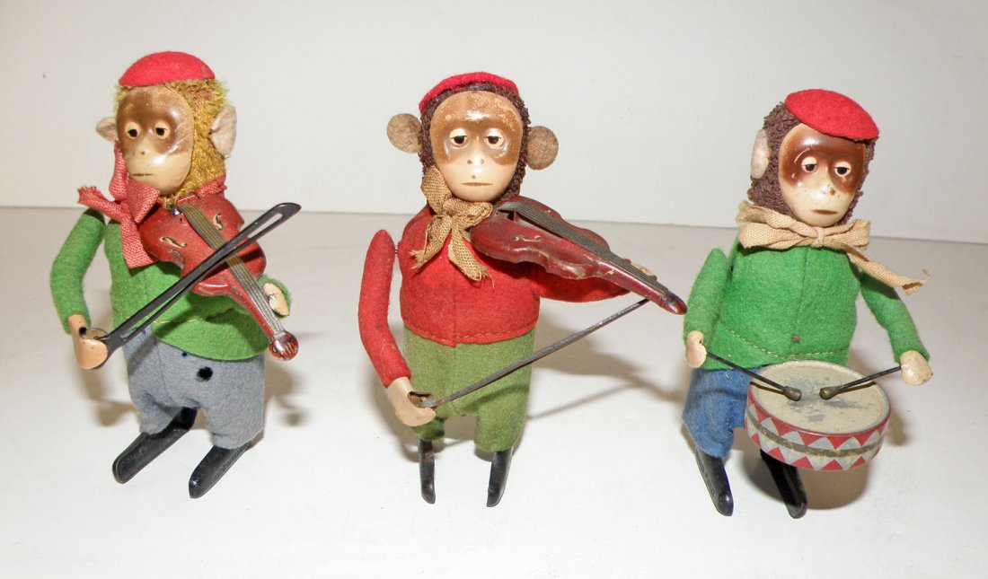 THREE SCHUCO WINDUP MUSICAL MONKEYS: Drumming monkey works fine and two violinist monkeys also work fine. Minor rubs and wear. 4 1/2" tall