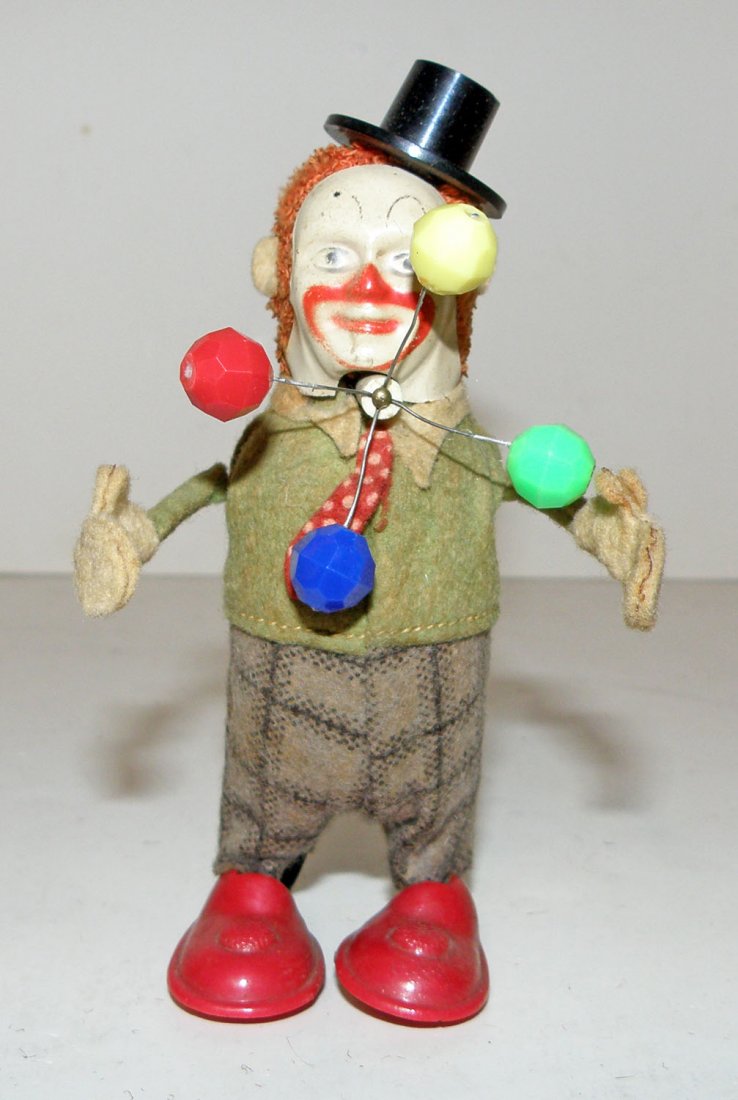 SCHUCO JUGGLING CLOWN: Working windup made in US zone Germany shows some wear to pants. 4 3/4" tall