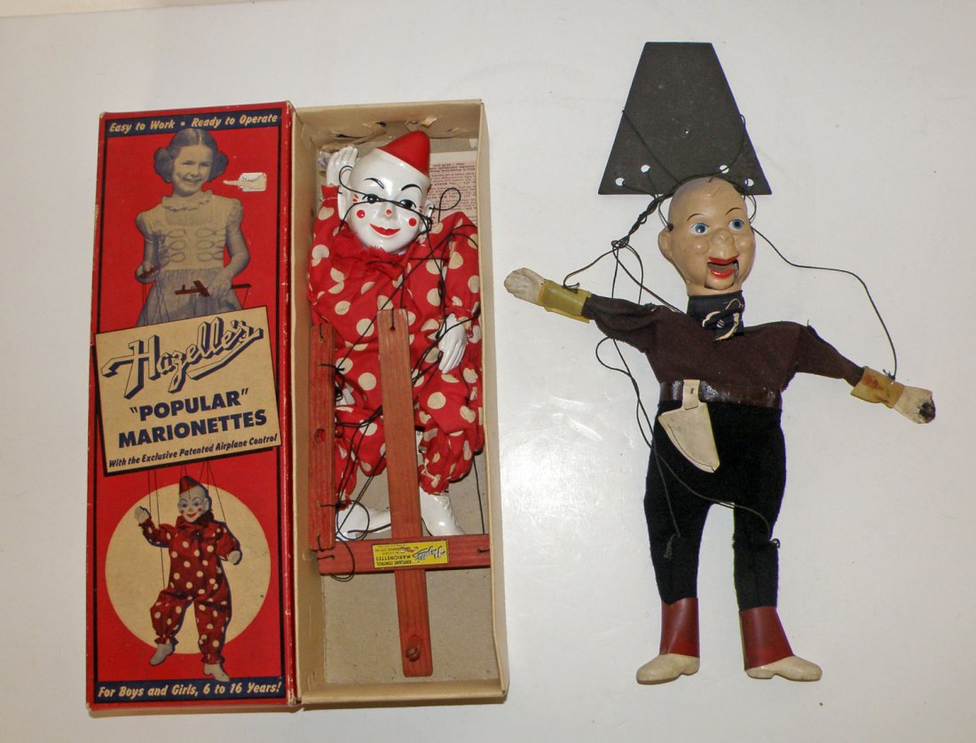 TWO MARIONETTES: Includes a Howdy Doody style figure and a boxed clown. Largest: 15" long