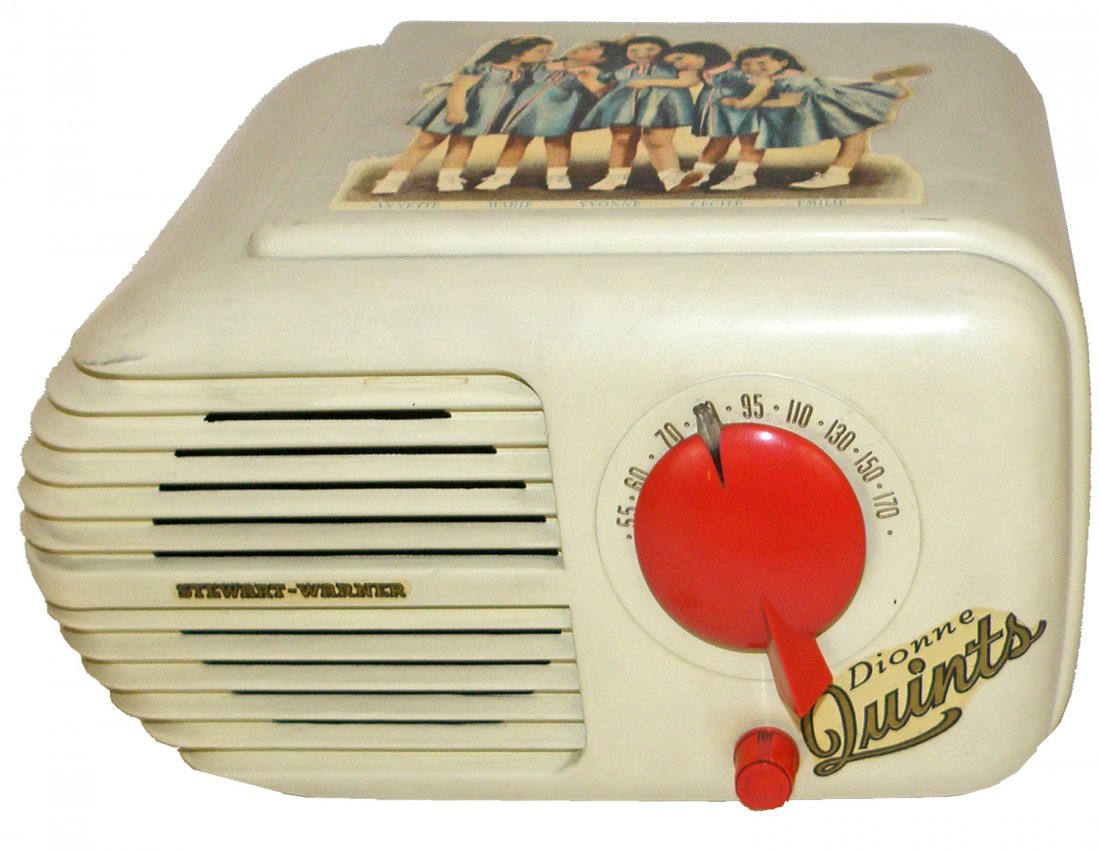 DIONNE QUINTUPLETS RADIO BY STUART-WARNER: The middle size of three versions of Dionne Quint radios made, decals are complete, light surface wear and soiling, radio is working. 9 1/2" long x 5 3/4" tall