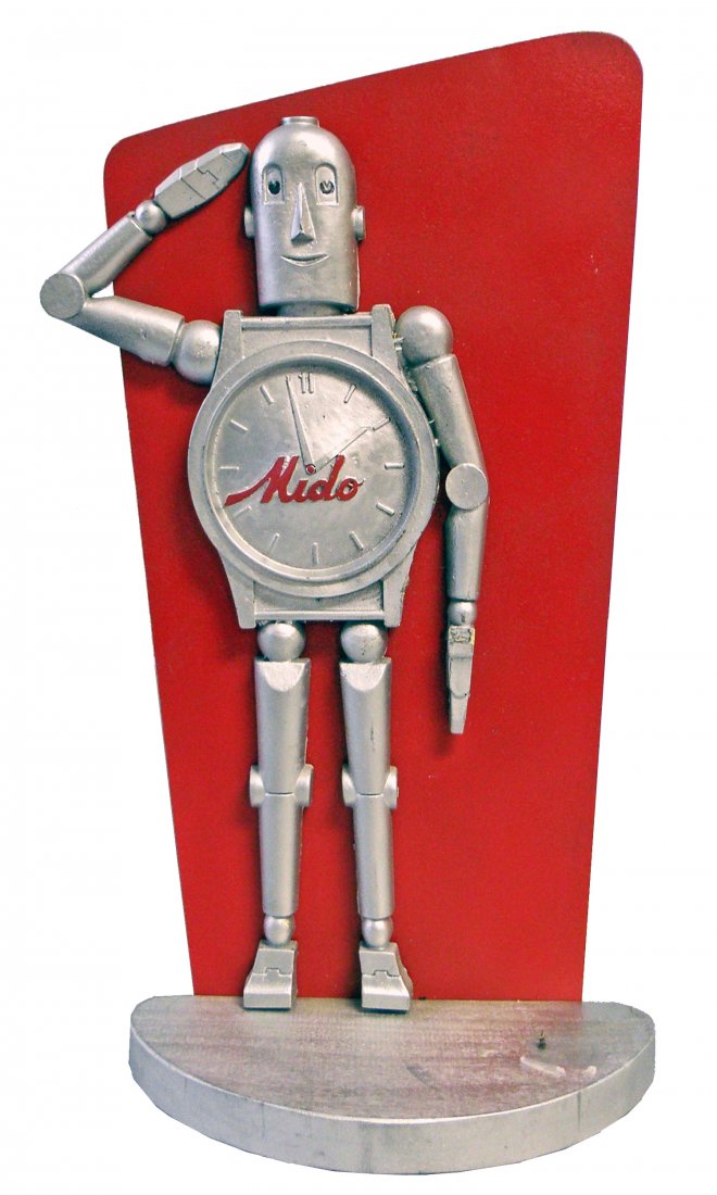 MIDO WATCH ADVERTISING FIGURE: Classic Mido robot design on wood base. Base original held a information card on stand which is no longer present. 16" tall x 8 1/2" wide