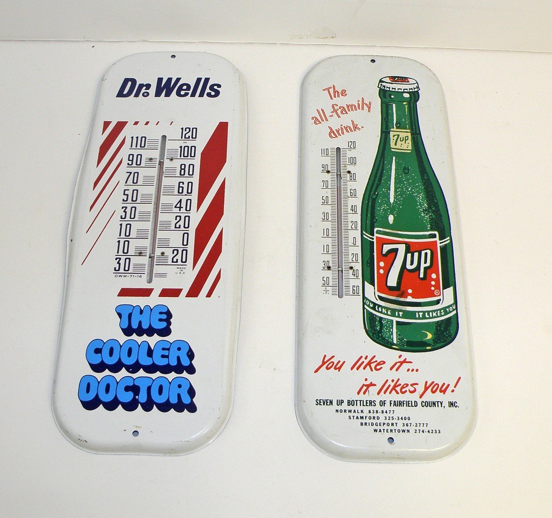 TWO TIN LITHO THERMOMETERS: Seven Up from Fairfield County Conn. & Dr. Wells a Dr. Pepper style drink made by Dad's Root beer. Some spotting and surface wear. 16" tall x 6" wide