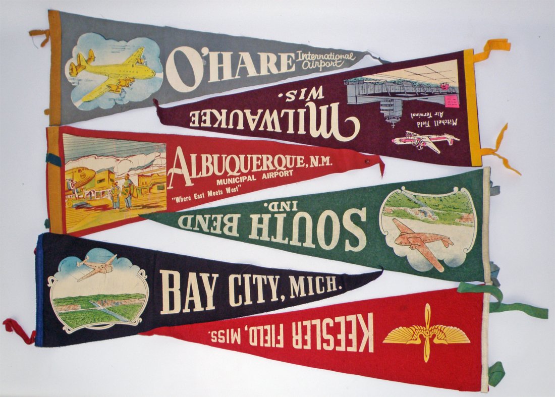 LOT OF SIX AVIATION THEME PENNANTS: Includes felt pennants from O'Hara Airport, Albuquerque Airport, Bay City Michigan, Mitchell Field, South Bend, and Keesler Field. Five show early propeller passenger planes. Largest is 26" long