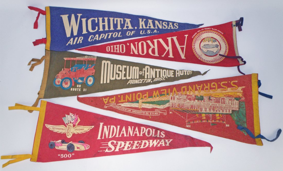 LOT OF FIVE TRANSPORTATION THEME PENNANTS: Includes Akron Ohio with a Zeppelin, Indy Speedway, etc. Largest is 27" long