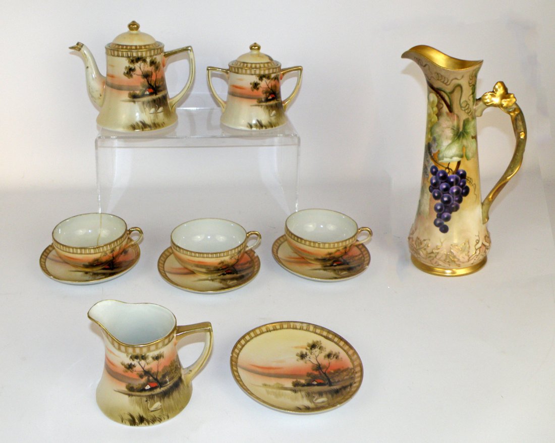 NIPPON TEA SET: Nippon tea set with teapot, creamer, sugar (no damage), 3 teacups (1 repaired), and 4 saucers (all with chips). Also includes Limoges ewer. Largest 12" tall