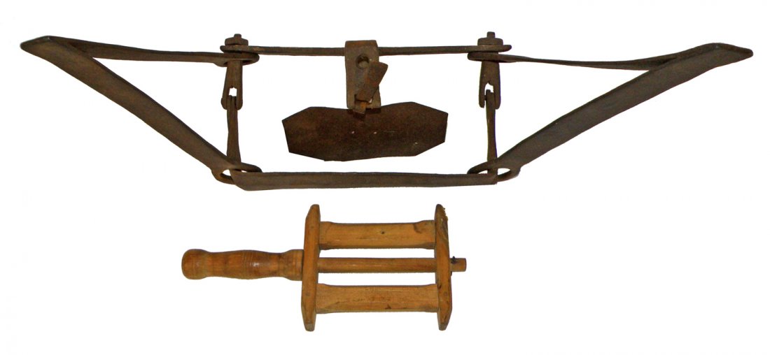19TH CENTURY WROUGHT IRON ANIMAL TRAP: Stamped W. Gregory. Works. Some surface wear. Jaw length is 10". Comes with early handmade fishing line holder. 31" long