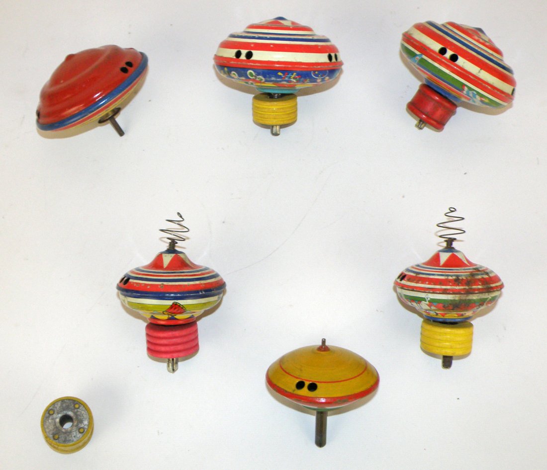 LOT OF TIN LITHO SPINNING TOPS: 1930's & 40's lithographed tops. Most with launchers. Varies