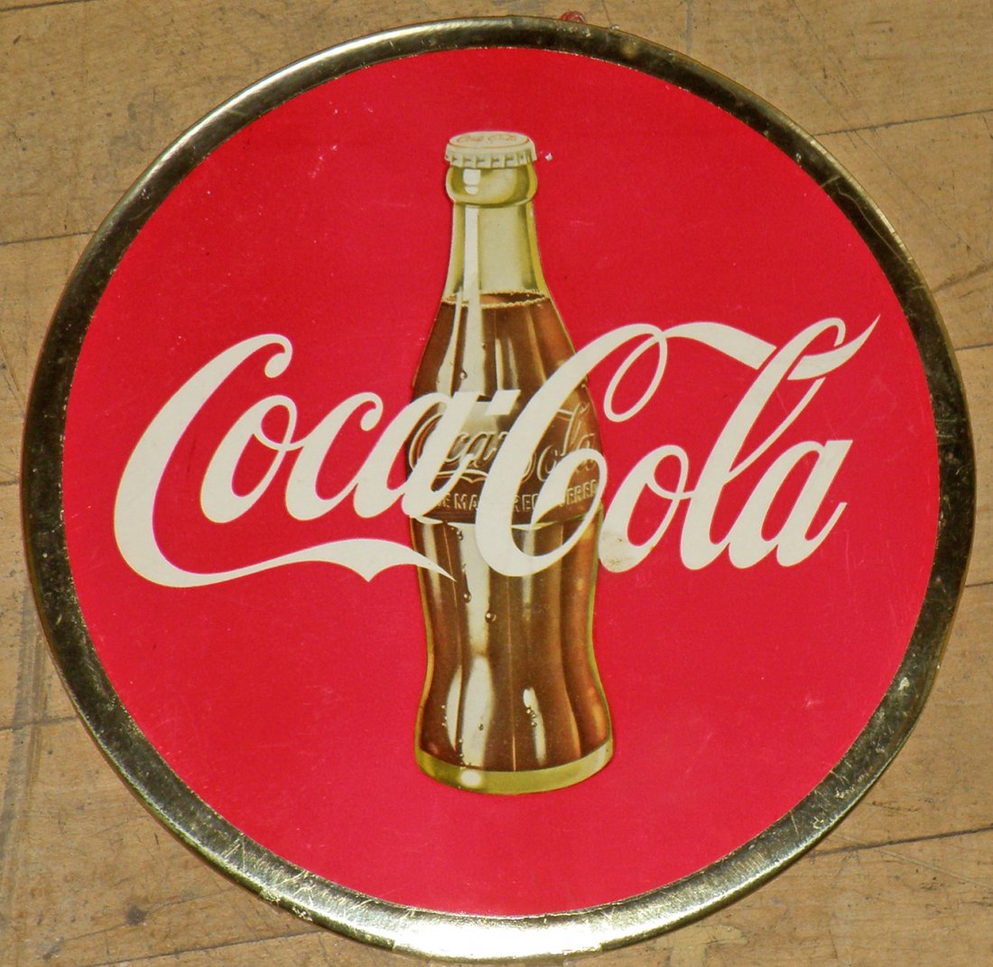 CELLULOID COKE BUTTON: Retains easel back and hanging string. Minor scuffing and edge wear. 9" deep