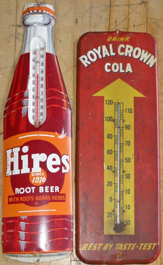 HIRES AND ROYAL CROWN THERMOMETERS: Both retain original sticks. Some surface wear. Discoloration to Royal Crown. largest 29"