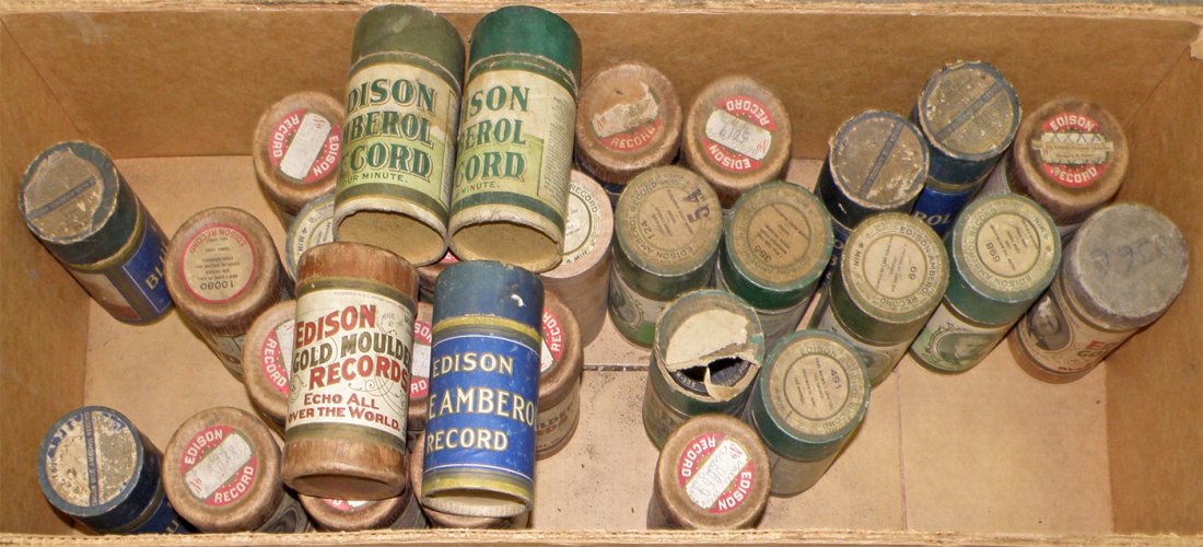 BOX OF EDISON CYLINDER RECORDS: Amberol, Gold Molded, and Blue Amberol. All in original sleeves. Total of 31 in box. 4 5/8" long