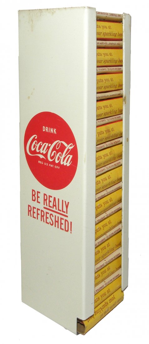 COCA-COLA WALL MOUNTED MATCH BOOK HOLDER: Complete with original Coca-Cola matchbooks. Very minor surface wear. 6 3/4" tall