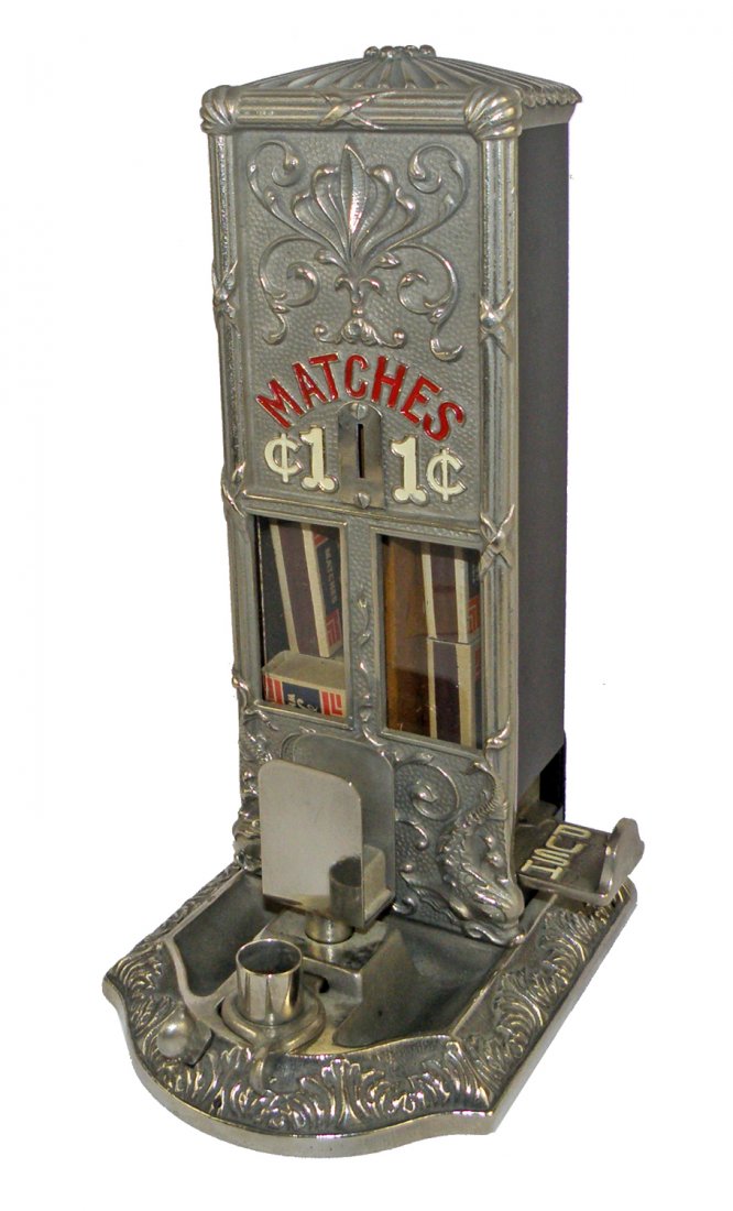 COIN OPERATED MATCH DISPENSER BY NORTHWESTERN: Includes matchbox holder and cigar cutter. Beautiful cast iron base and front. 14" tall