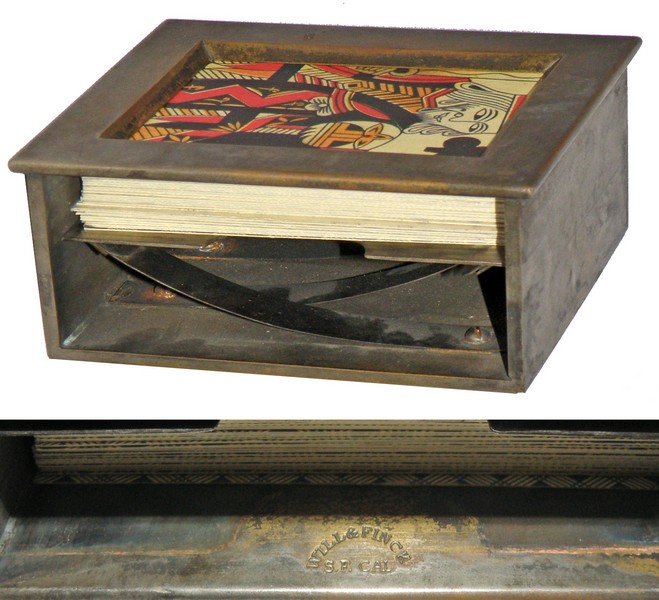 GAMBLING CARD SHOE BY WILL & FINCK: Original dealers shoe with reproduction period style playing cards. Signed Will & Finck, San Francisco, CA. Shows some surface and use wear. 4" x 3 1/8" x 1 5/8"