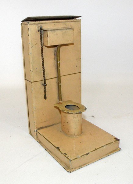 GERMAN TIN TOILET: Hand painted tin with working toilet. Some scattered chipping. 7 1/2" tall