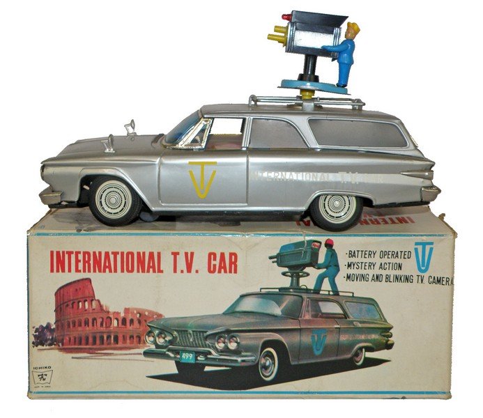 BOXED B/O INTERNATIONAL T.V. CAR: Made by Ichiko. Complete except for one missing taillight lens. Some very minor surface wear. Complete original box has some wear and creasing to lid. Box is VG-Fine. 12 1/4" long