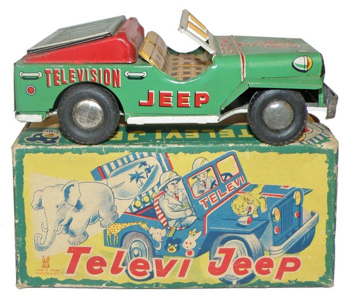 BOXED TELEVISION JEEP: Made by Ushigaya. Working friction toy with very light play wear. Original box has one corner split to lid. Box is VG. 7" long