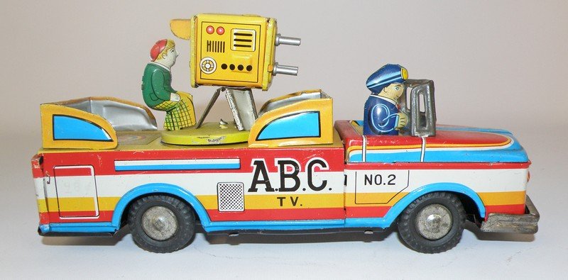JAPANESE TIN A.B.C. T.V. TRUCK: Colorful toy with moving camera in back. Light play wear. 9 1/4" long