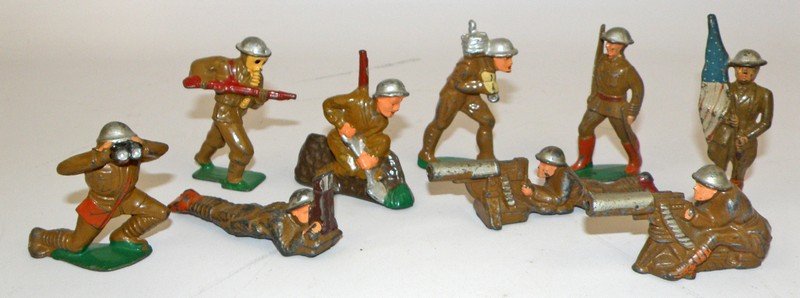 NINE LEAD SOLDIERS: Barclay & Manoil and one grey iron flag carrier. Scattered paint wear. varies