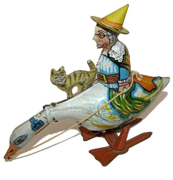 MARX MOTHER GOOSE WIND UP: Classic 1930's toy with original cat. Mechanism works. Needs oil. Some scattered and light play wear. 9" long