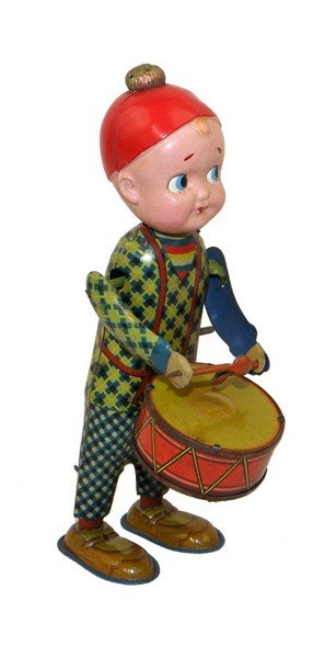 PRE WAR JAPANESE WIND UP DRUMMER: Tin and celluloid by Yanoman. Works fine. Minor wear. 8 1/2" tall
