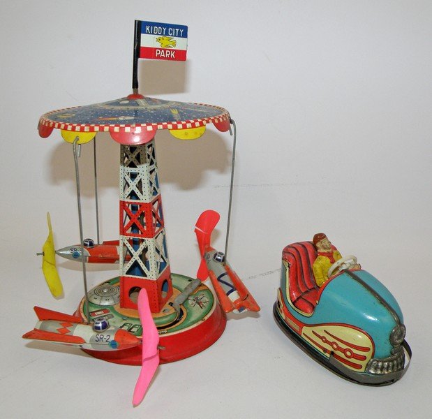 TWO WIND UP CARNIVAL TOYS: Includes scarce Hoch and Beckmann bumper car and Space ride by ATC. Both with light play wear. largest 8 1/2" tall