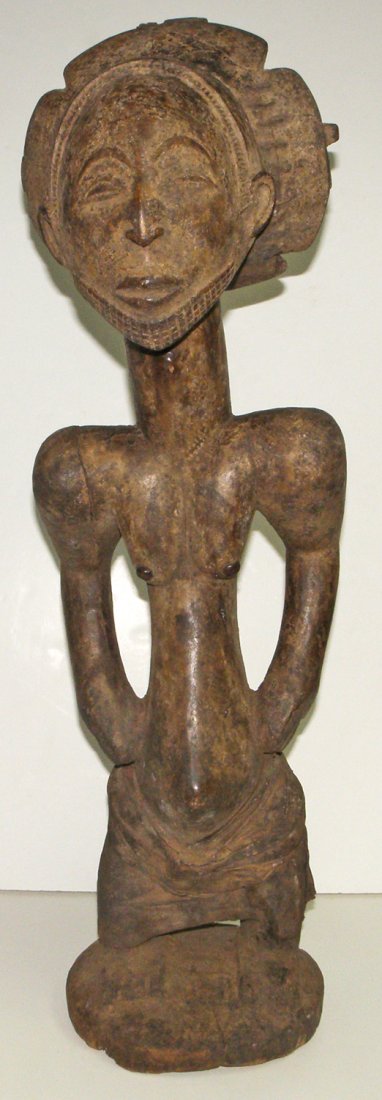 CARVED WOOD HEMBA ANCESTRAL FIGURE: Hemba ancestral figure, attached to the communal shrine. Used for offering to the ancestors after successful consultations This figure also was used as a fetish, the hole on the fore head was used for