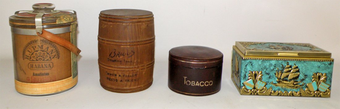 FOUR TOBACCO HUMIDORS: Includes a H. Upmann, Habana cigars, With a 1912 Cuban Tax stamp. Briggs barrel shaped humidor. Italian leather and ceramic humidor & a wood lined tin for Bering cigars. Largest 8" Tall