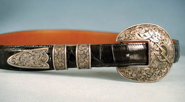 Ernie Marsh Buckle Set on Alligator Belt: 4-piece 1" set with deep scroll engraving on oval buckle, with gold lightning bolt over "C" monogram. Marked MARSH / sterling - 14K, on 34" alligator belt