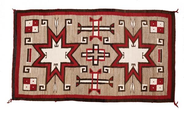 Navajo Rug: 79" x 46" Floating, hooked, eight-pointed stars and arrows in red, black, white on a grey field and solid outside borders. Fine condition, c. 1930.