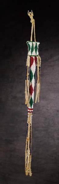 Kiowa Beaded Awl Case: 18" total length, classic beading with diamond designs in red, green, blue and white, bead edging on suspensions. Fine condition, c. 1880.
