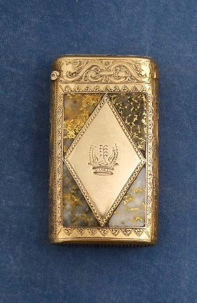 Gold & Gold Quartz Match Safe: Circa mid to late 1800s with 4 gold quartz panels inset into gold with gold quartz inset into lid (cracked in two places). Finely engraved over entire body with front panel containing a winged crown.