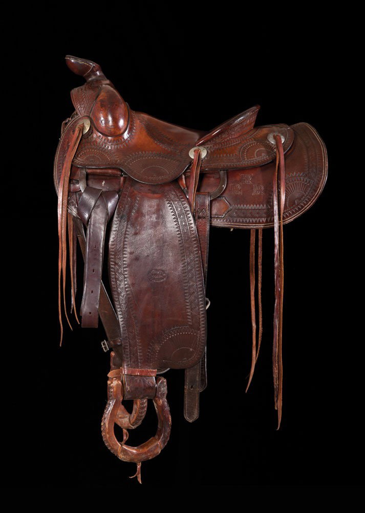 R.T Frazier His and Hers Saddles: Pair of saddles by the famous Pueblo maker. Tooling in a sunburst design on each corner with round skirts. Well marked with 13" and 14" seats. Marked on each skirt with 3R and RRR brands. Overall very