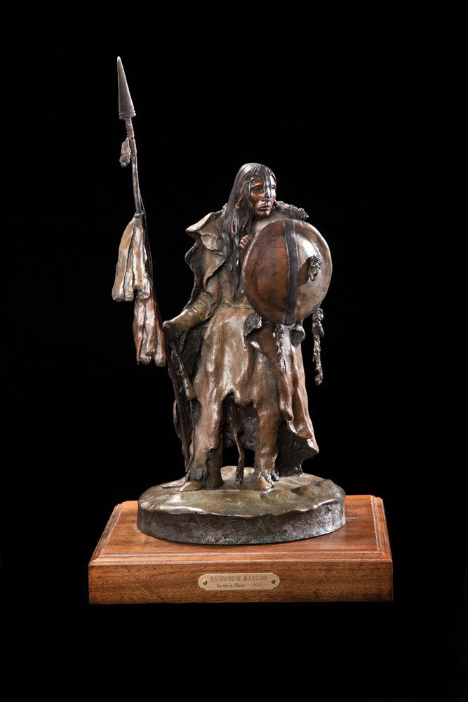 Assinaboine Warrior: Bronze 18" tall Stands on 1 ¾" wood base Signed with initials RBD 1/30 Colored patina Estate of noted Northern California collector