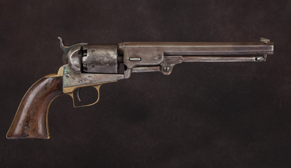 Colt 1851 Navy 2nd Model: #1360, all matching numbers, .36 caliber, 7 1/2” barrel, pitting in grooves the length of the bore; surfaces are bright having been vigorously cleaned; 30% cylinder scene, grips are slightly undersi