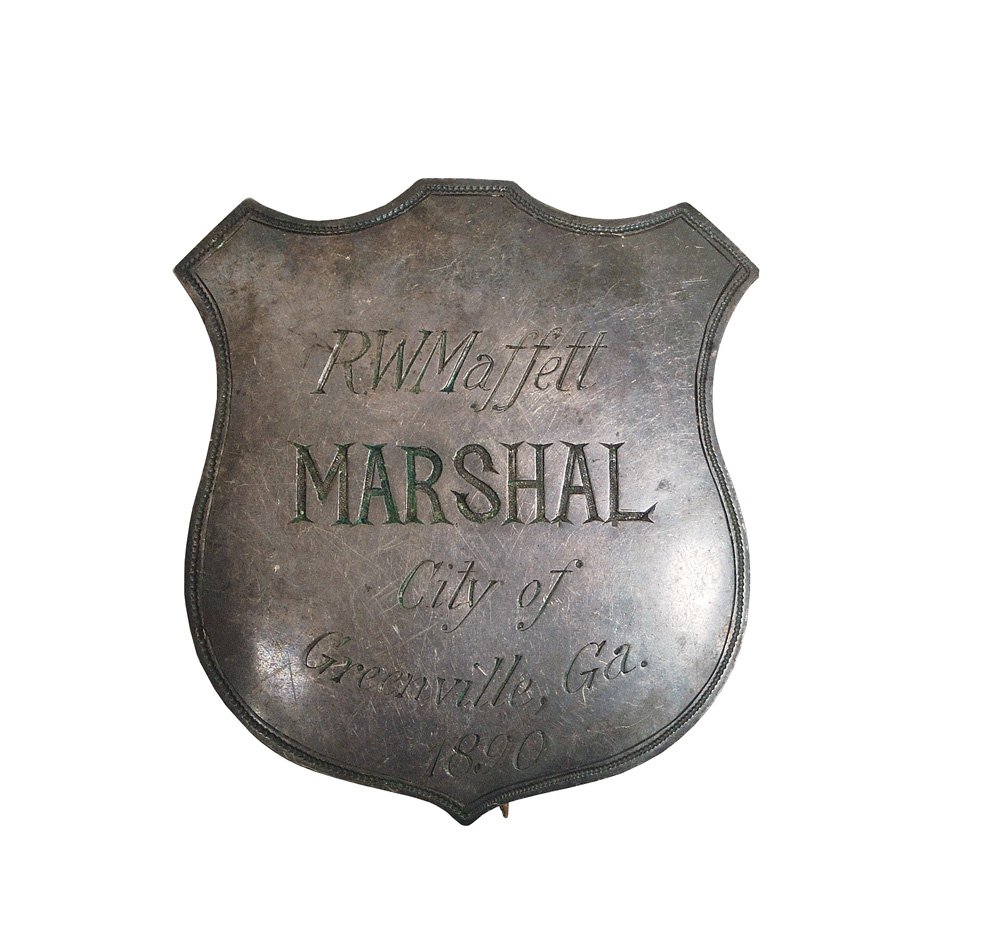 Marshal Badge: “R.W. Maffett – Marshal – City of Greenville, Ga. 1890” Hand engraved, large shield badge. Jeweler made sterling with T pin. No hallmark, excellent condition, not cleaned.