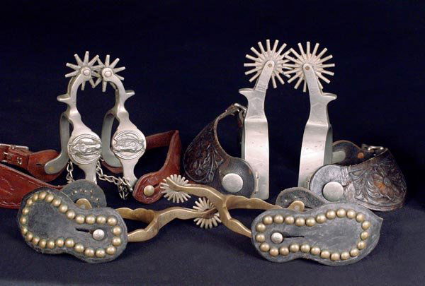 Three Pair of Buermann Star Marked Cowboy Spurs: (a) Star Steel Silver Horseheads with heel chains; (b) Star Steel Silver engraved with 2 1/2" rowels; (c) Hercules Bronze Gal Leg pattern #2315