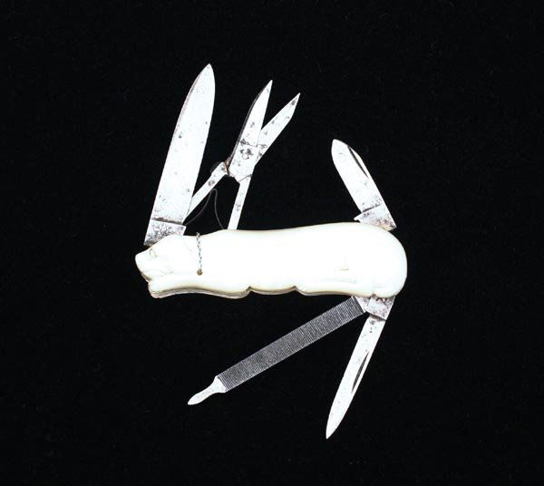 H. Bokers & Co. Improved Cutlery: wonderful dog shaped pearl slabbed pocket knife. 3 blade with scissors. Silver neck chain. blades show slight sharpening but retain original shape. 2 1/2" closed, 5 1/2" open