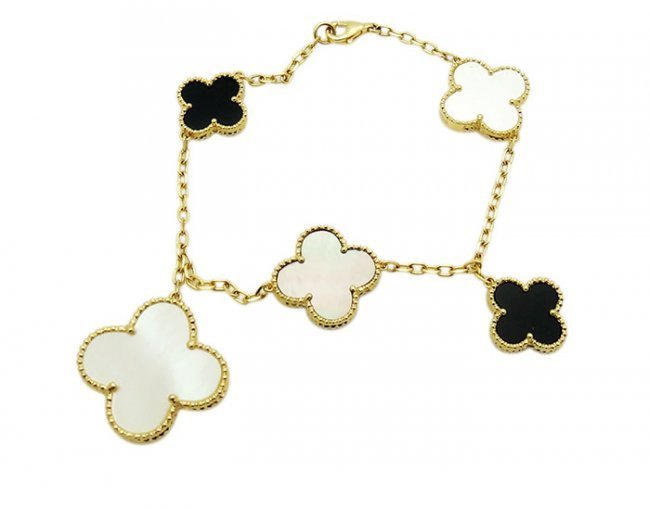 Van Cleef & Arpels Mother-of Pearl 5 Motif Bracelet: Van Cleef & Arpels Mother-of Pearl 5 Motif Bracelet Length: 7.5 inches, weight is 13.7 g. Motifs: 24.5mm, 17.5mm, 14.3mm. Yellow gold. Stones Mother-of Pearl and Onyx Retail price $6,100.