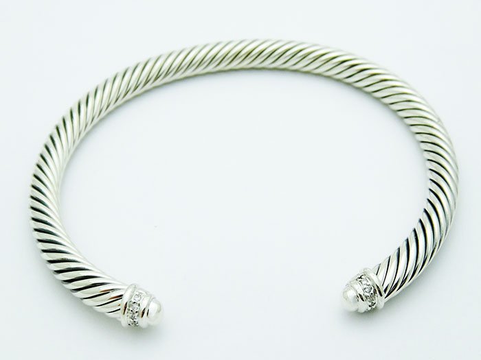 David Yurman 925 Sterling Crossover Ring & Diamonds: David Yurman 925 Sterling Double X Crossover Wide Ring with 0.09tcw Diamonds This piece bares full DY. hallmarks. Retail Price: $675 Details: Brand: David Yurman Condition: Like New Style: Ring Materi