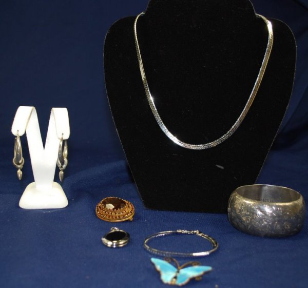 MIXED JEWELRY LOT: 7PC LOT INCLUDING; ORNATE SILVER BANGLE BRACELET MONOGRAMED "ELIZABETH" w/ LOCKING CLASP, NORWEIGAN ENAMEL BUTTERFLY PIN, STERLING PENDANDT LOCKET, PAIR OF SILVER EARRINGS, COSTUME RUBY PIN, MATCHING 