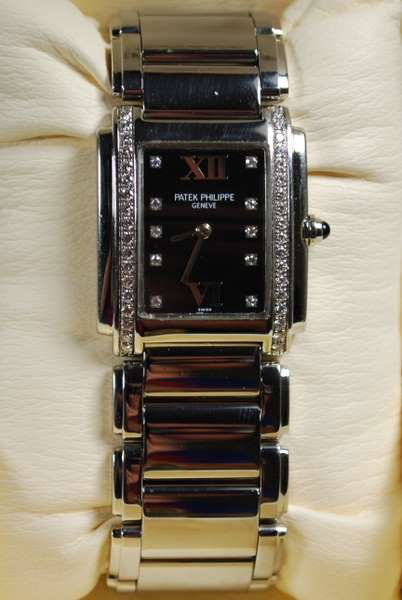 LADIES PATEK PHILIPPE "24": STAINLESS STEEL &FACTORY DIAMOND BEZEL, QUARTZ PATEK MOVEMENT WITH BOX DOUBLE DEPLOYMENT BAND, SHIPPING TO BE $12 + INS. OR BUYER CAN ARRANGE SHIPPING.