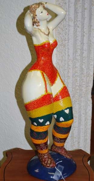 PAPIER - MACHE BOTERO STYLE LADY: COLORFULLY PAINTED SCUPTURE DEPICTING DANCING WOMAN, MINOR CHIPS IN PAINT, 20.5" TALL, BUYER ARRANGES SHIPPING, WE CAN RECOMMEND LOCAL SHIPPERS.